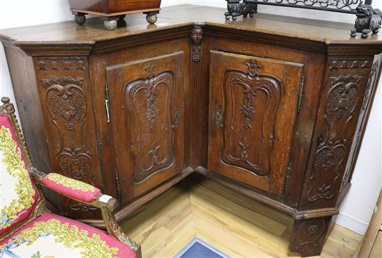 An 18th century French oak corner armoire, W.5ft 8in. D.1ft 10in. H.3ft 9in.